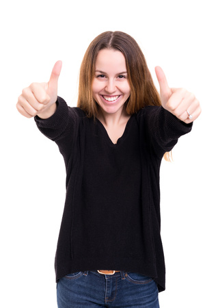 Beautiful young woman signaling ok, isolated over whiteの写真素材
