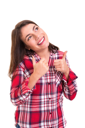 Beautiful young woman signaling ok, isolated over whiteの写真素材