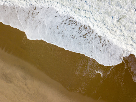 Drone view of the beautiful Portuguese beach of Costa Nova do Prado - Aveiroの写真素材