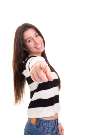 Young beautiful woman pointing at you, isolated over whiteの写真素材