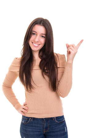 Young beautiful woman presenting your product, isolated over white backgroundの写真素材