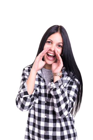 Woman screaming at someone, isolated over a white backgroundの写真素材