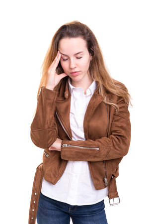 Young woman with a strong headache, isolated over white backgroundの写真素材