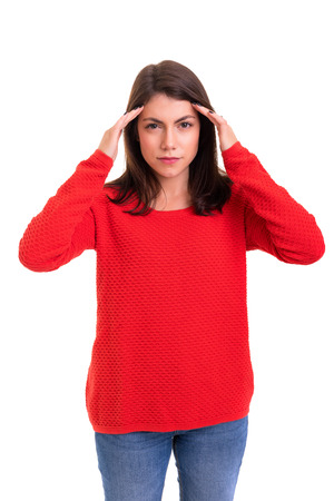 Young woman with a strong headache, isolated over white backgroundの写真素材