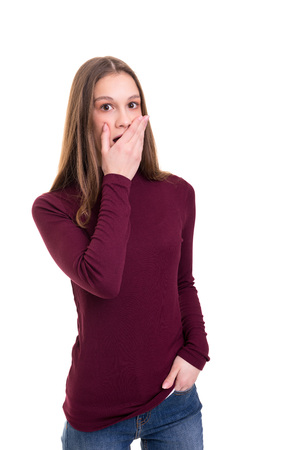 Surprised young woman isolated over white backgroundの写真素材