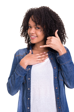 Happy young african woman student making "call me" sign with handの写真素材