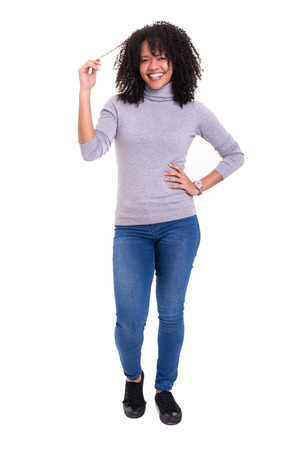 Beautiful young african woman posing isolated over whiteの写真素材