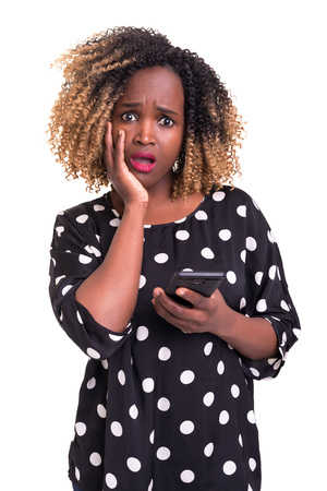 Young beautiful african woman at the phone, isolated over white backgroundの写真素材