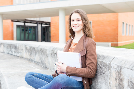 Happy young student at the university campusの写真素材
