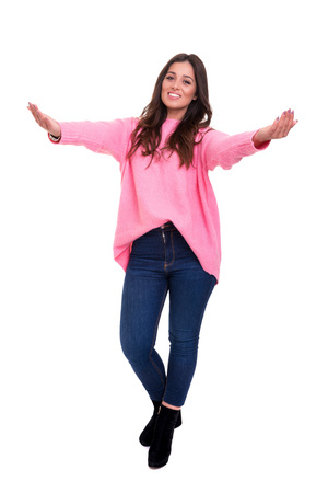 Studio shot of a beautiful woman offering a hugの写真素材