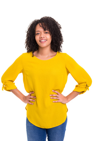 Beautiful young african woman posing isolated over whiteの写真素材