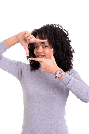 Young woman making framing key gesture - isolated over white