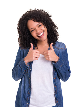 Beautiful young woman signaling ok, isolated over whiteの写真素材