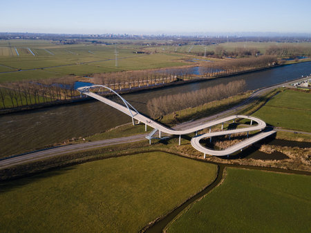 Pedestrian and cyclist bridge over a large water way in Nigtevecht The Netherlands. Liniebrugの写真素材