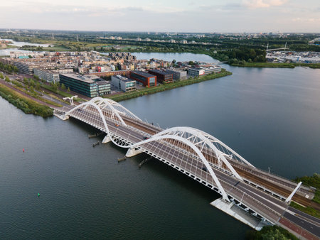 Aerial drone video of the Enneus Heermabrug in Amsterdam, The Netherlands going to Ijburg and...