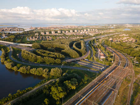 Aerial view of an infrastructure highway with cars going over it drivingの写真素材