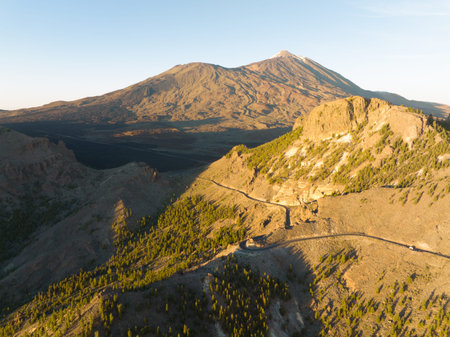 Aerial of a mountain range at sunset in Tenerife Spain, nature island, trees hills rocks, cliffs and mountains at golden hour. Europeの写真素材