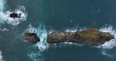 Cliffs aerials and mountain aerials. Cliffs in the ocean with the atlantic ocean beating on the rocks. beautiful nature and island Madeira Portugal.の写真素材