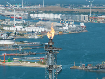 Antwerpen, 9th of August 2022, Belgium. Flaring burning of combustible exhaust gases during petroleum production. Burning combustible substances. Refinery in the port of Antwerpen.のeditorial素材