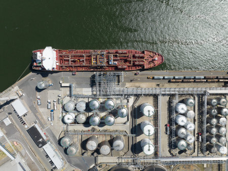 Antwerpen, 9th of August 2022, Belgium. Petrochemical tanker vessel ship docked. Loading and unloading import and export petroleum products in the port of Antwerp. Aerial drone overview.のeditorial素材