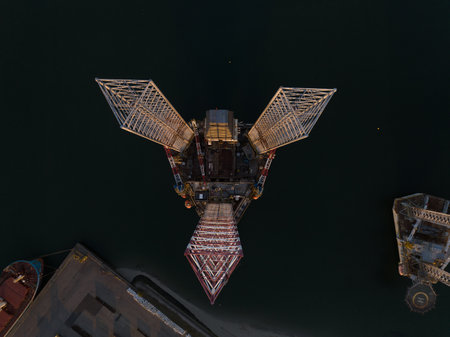 Offshore floating installation sea platform petroleum gas seabed ocean production facility. Steel concrete structure drilling rig aerial drone view above water.の写真素材