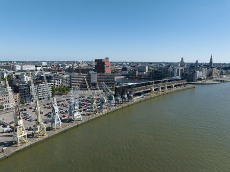Antwerpen , 9th of August 2022, Belgium. MAS - Museum aan de Stroom and city skyline and Loodswezen Schipperskwartier. Downtown city center aerial drone overview. Europeのeditorial素材