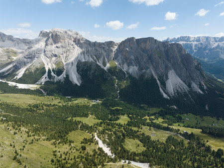 Dolomites Italy mountain range holiday alps landscape clouds aerial cinematic. Mountain aerial drone view. Panorama overhead beautiful landscape.の写真素材