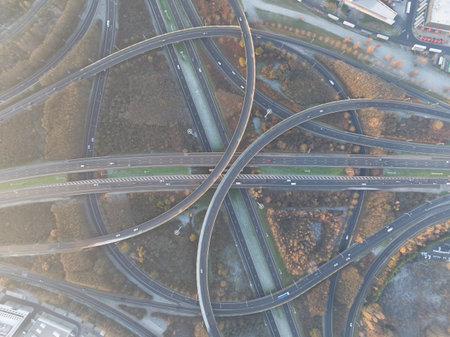Complex traffic intersection roundabout. Symbolic for choice, direction, route. rond point de grand bigard near Brussels. Belgium. E19. Aerial drone overhead top down view.の写真素材