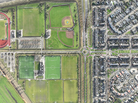 Aerial drone top down view on sports field, amateur sports grounds. Birds eye top down overview....