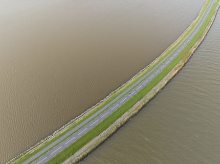 Driving road at the Markermeer, road running through lakeの写真素材