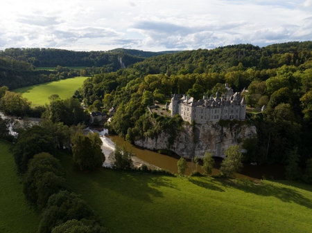 Fairy tale medieval castle in a green hill landscape.の写真素材
