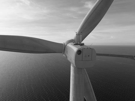Offshore wind turbines, close up view, winds and generate vast amounts of energy. Afsluitdijk, The Netherlands. Sepia colored, black and whiteの写真素材