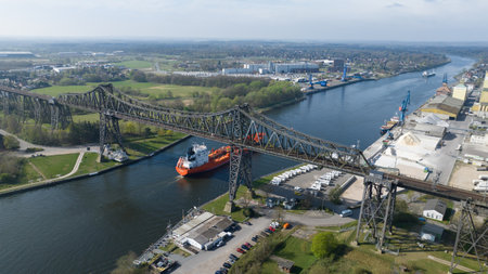 Rendsburger Hochbrucke, high overpass bridge over the Kiel canal, large industiral ships transportation from the Ostsee to the Nordsee, North-Octese Canalの写真素材