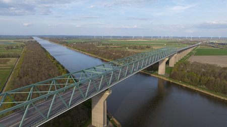 high bridge over Kiel canal so large ships can pass freely under the bridge. Infrastructre, waterway and road. Logistics, sea, waterway transport. Aerial view.の写真素材
