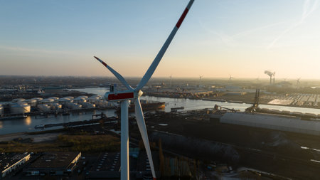 Close up view of wind turbines in the port of Amsterdam, transport, dry bulk, commercial and industrial shipping. Sunset, golden hour.の写真素材