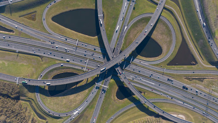multi level traffic intersection highway, clover leaf, multil lane. Mobility and transport, to pdown photo. Aerial photo.の写真素材