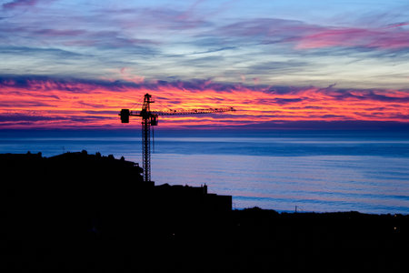 construction site view at the sunset over the sea