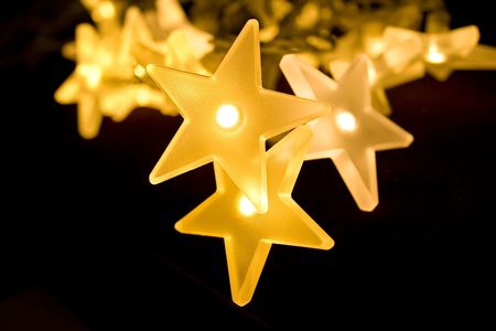 Christmas lights decoration closeup in isolated background blackの写真素材