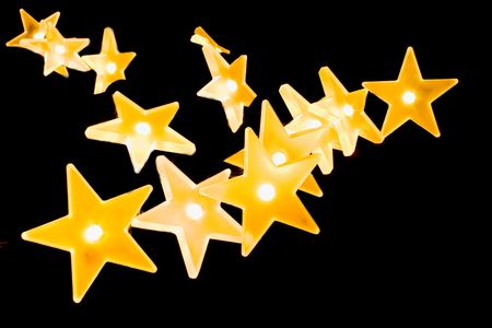 Christmas lights decoration closeup in isolated background blackの写真素材