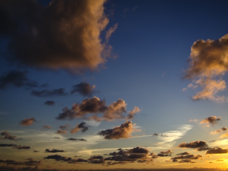 cloudy and multicolored sunset as seen in Portugal atlantic coastの写真素材