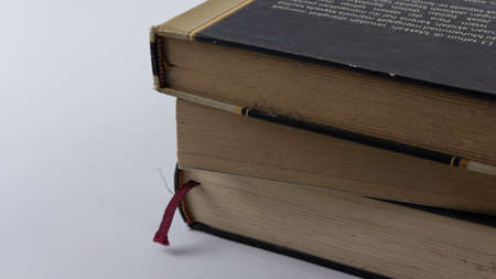 a pile of old books with brown paperの写真素材