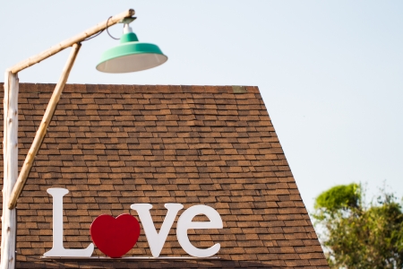 Wording  Love  on the roof with lampの写真素材