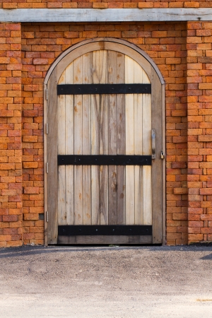 Wooden door on brick wallの写真素材