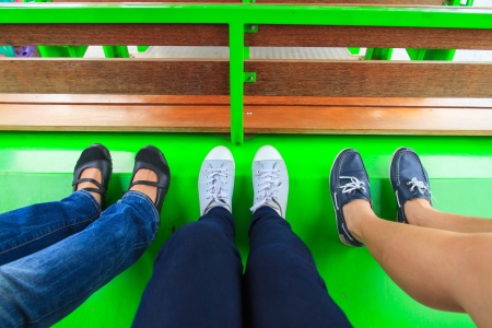 Legs and shoes of 3 peopleの写真素材