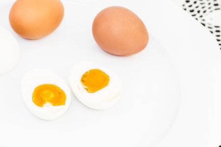 Salted egg and raw egg on white dish