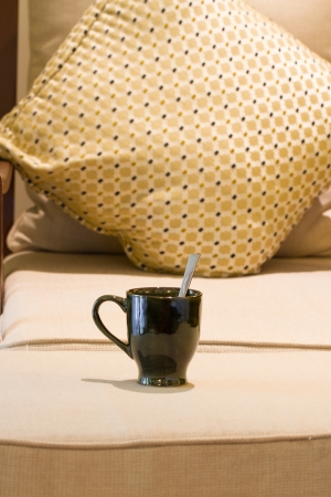 cup of tea on sofa bedの写真素材