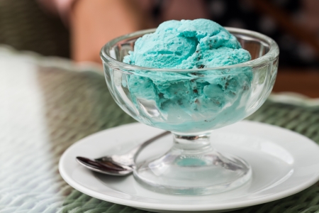 scoop of mint chocolate chip ice-cream in a bowlの写真素材