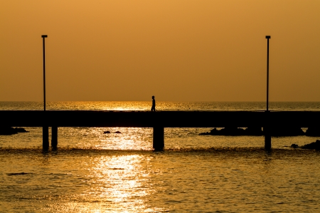 people action on bridge in silhouette modeの写真素材