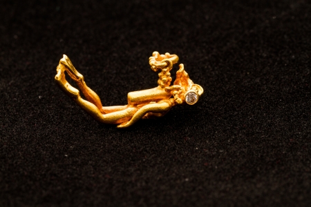 scuba diver pendant made by goldの写真素材