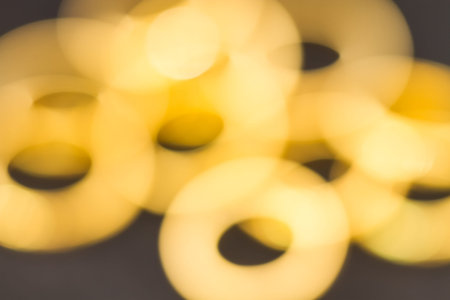 blur shot of gold ringsの写真素材